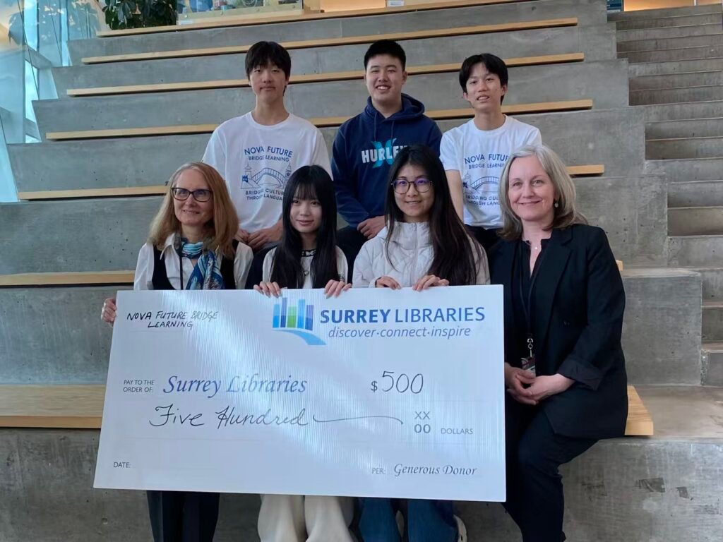 Nova volunteers presenting a donation to Surrey Libraries